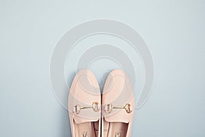 Woman pink pastel shoes over blue background. Fashion blog, sprind and summer urban style, online shpping. Minimal flat lay, top photo
