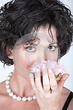 Woman with pink peony flower