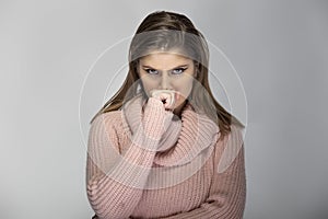 Woman in Pink Sweater Looking Angry