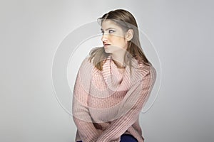 Woman in Pink Sweater Looking in Disgust