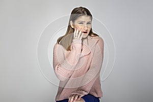 Woman in Pink Sweater Looking Disgusted