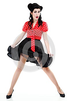 Woman pinup retro hairstyle posing in studio