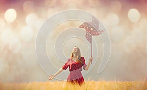 Woman with Pinwheel toy on field