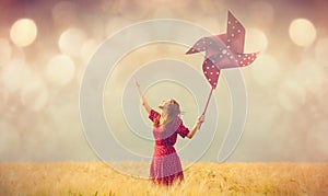 Woman with Pinwheel toy on field