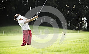 Woman pitching at golf course.