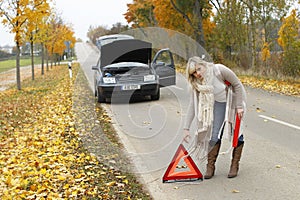 Woman places an emergency sign