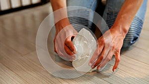 Woman placing a crystal on the floor to harmonize the energies