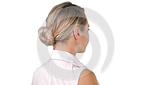 Woman placing hands on her hips on white background.