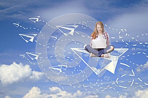 Woman on plane using laptop