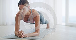 Woman, plank and fitness in a home gym studio for abdominal strength and health. Abs, arms and fit female planking in a