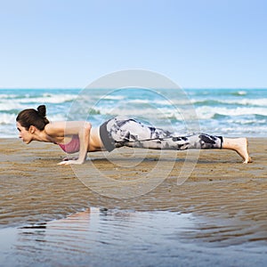 Woman Planking Stretching Flex Training Healthy Lifestyle Beach Concept photo