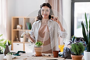 woman planting and fertilizing flowers at home