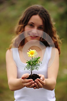 Woman planting a flower