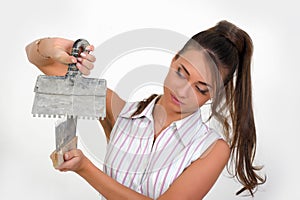 Woman plastering the wall