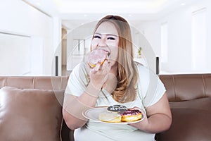 Woman with a plate of donuts