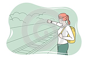 Woman on platform experience train delay