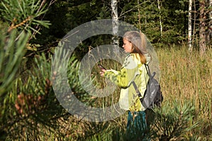 Woman play Geocaching.