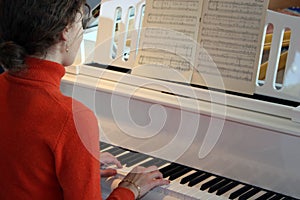 Woman play on piano