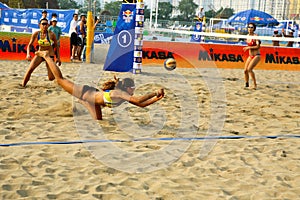 Woman player save in beach volleyball game