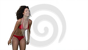 Woman playing beachball in her bikini