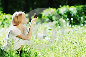 Woman playing with a butterfly