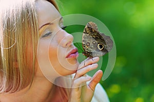 Woman playing with a butterfly