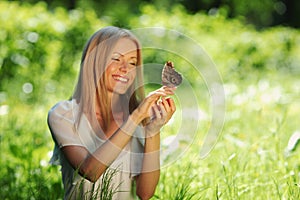 Woman playing with a butterfly