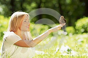 Woman playing with butterfly