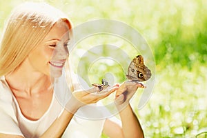 Woman playing with butterfly