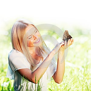 Woman playing with butterfly