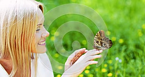 Woman playing with a butterfly