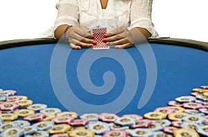 Woman playing cards with poker chips