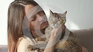 Woman playing with a cat.