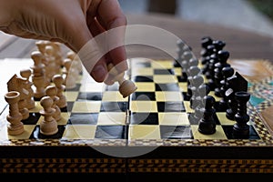 Woman playing chess game in the morning photo