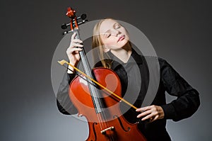 The woman playing classical cello in music concept