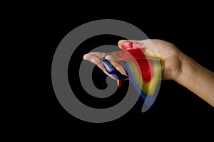 Woman playing with colorful slime on black background, closeup. Antistress toy