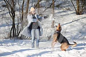 woman playing with a dog