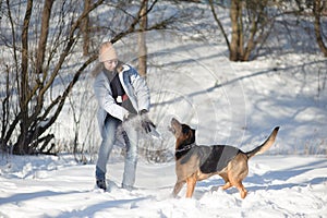 woman playing with a dog