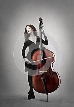 Woman playing a double bass photo