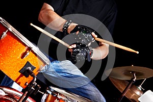 Woman playing drum .