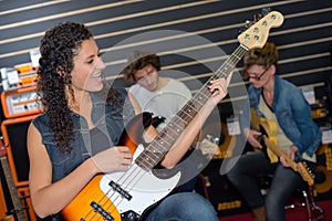 Woman playing electric guitar