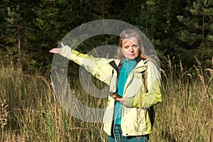 Woman playing geocaching.