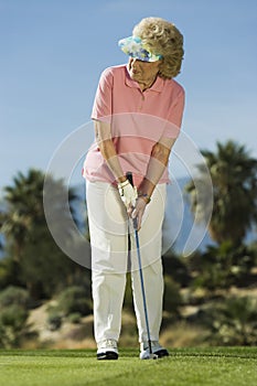 Woman playing golf