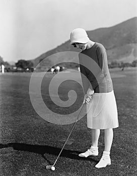 Woman playing golf