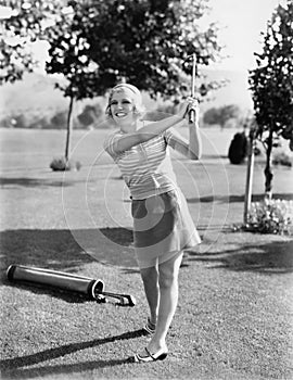 Woman playing golf on a golf course