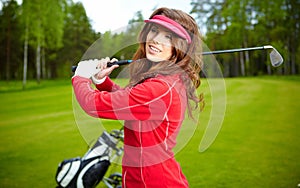 Woman playing golf on a green