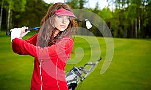 Woman playing golf on a green