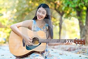 Woman playing guitar