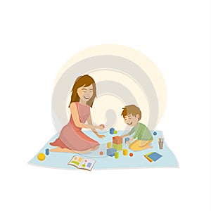 Woman playing with her child boy developing games sitting on the floor isolated