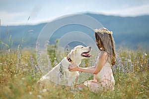 Woman playing with her dog in the street